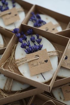 lavender candles in boxes with thank you tags on them