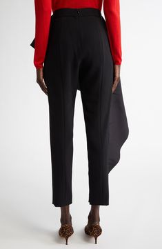 Wes Gordon's passion for sculptural silhouettes comes through in these runway-showcased crepe pants artfully draped with a cascading ruffle. 29" inseam; 12" leg opening; 11 1/2" front rise; 17" back rise (size 4) Hidden back-zip closure Zip cuffs 92% polyester, 8% polyurethane Dry clean Made in the USA Designer Clothing Hispanic & Latinx Owned/Founded Evening Wide Leg Ruffled Pants, Evening Wide-leg Ruffled Pants, Chic Asymmetrical Evening Bottoms, Evening Wide Leg Pants With Ruffles, Chic Asymmetrical Bottoms For Evening, Wide Leg Ruffled Pants For Evening, Ruffled Wide Leg Pants For Evening, Elegant Asymmetrical Hem Work Pants, Stretch Asymmetrical Bottoms For Evening