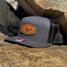 Elevate your headwear game with our Richardson 168 Trucker hat featuring our exclusive Denali designed laser-engraved leather patch. Each hat is a unique blend of style and functionality, with an adjustable SnapBack closure ensuring a perfect fit for the average-sized adult head or a one-size-fits-all option.  We take pride in sourcing the highest quality veg-tanned leather for our patches, guaranteeing durability and a premium finish. Our meticulous hand-sewing process ensures longevity and cra Laser Engraved Leather, Stitching Leather, Leather Patches, Black Charcoal, Trucker Cap, One Size Fits All, Laser Engraving, Hand Sewing, Caps Hats