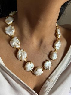 This stunning handmade necklace features premium-quality natural pearls set in the finest brass. It sits comfortably on the neck, making it perfect for most outings and night events. The necklace is lightweight and features an adjustable lobster claw closure for a secure fit. A true standout piece, it's sure to draw compliments wherever you go. Weight: 70 grams Natural Pearl Necklace, Natural Pearl, Pearl Set, Handmade Necklace, Natural Pearls, Lobster Claw, Handmade Necklaces, Favorite Jewelry, Charm Necklace