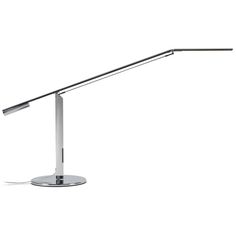 a desk lamp that is on top of a metal stand with a white light behind it