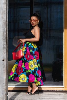 "A splash of colour represents vibrancy, aliveness, and all things beautiful! The Petra floral skirt is not just an everyday piece, this one is a timeless \"feel good\" piece that you can wear at your bestie's wedding, also suitable for brunch dates with family and friends, but we also love that you can pass this skirt from generation to generation because of it's classic and ageless look. Here is to forever with Petra! Unlined Two side pockets  Skirt overall length is 35 inches. Elastic waist b Trendy African Dresses, Midaxi Skirt, Brunch Dates, African Print Clothing, All Things Beautiful, Look Here, Skirts With Pockets, Fashion Wear, African Dress