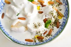 a bowl filled with yogurt and almonds