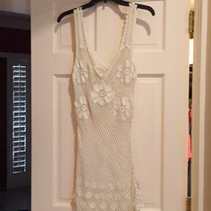 Nwot Cream Knit Dress With Flowers. Great To Wear A Fp Colored Tank Under It Or As A Sexy Bathing Suit Cover-Up. White Knit Mini Dress For Beach, White Knit Mini Dress For The Beach, White Knit Mini Dress For Vacation, White Crochet Knit Dress With V-neck, White V-neck Crochet Knit Dress, Cream Knit Dress, Cream Knitted Dress, Free People Lace Dress, Dress With Flowers