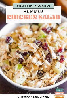 a white bowl filled with chicken salad on top of a table