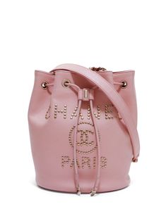 circa 2017-2018 light pink calf leather bucket body stud embellishment signature interlocking CC logo leather and chain-link shoulder strap detachable shoulder strap drawstring fastening main compartment internal zip-fastening pocket internal logo patch full lining gold-tone hardware Serial number: 29371962 This item comes with an original authenticity seal. Condition: GOOD. This previously owned and used item is in good condition with minimal signs of use. This may include fading of material or plating and scratches. Purchasing this item continues its narrative and reduces the environmental impact by avoiding the use of new resources needed to make the product from scratch, such as water, materials and electricity, and avoiding additional manufacturing impact. Learn more about what makes Bucket Shoulder Bag With Logo, Pink Crossbody Shoulder Bag With Metal Logo, Pink Shoulder Bag With Metal Logo For Everyday, Designer Pink Bag With Metal Logo, Everyday Pink Shoulder Bag With Metal Logo, Designer Pink Shoulder Bag With Logo Hardware, Luxury Pink Bag With Metal Logo, Pink Crossbody Bag With Metal Logo, Luxury Pink Bags With Metal Logo