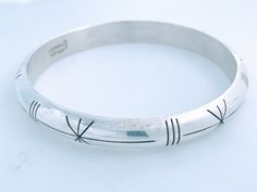 "Vintage Taxco Mexico Minimalist Half Round Polished Sterling Silver Bangle With Etched Cut Accents. Smooth thick 9.5mm half round band. Lightly cleaned ready to wear. Markings: Mexico 925 TP-104, Mexico Measurements: Approx 8.0\" total inside circumference, 2 5/8\" inside diameter across, 9.5mm thick. Total Weight: 25.69grams Condition: Good vintage cleaned ready to wear reflecting standard wear. Photos of actual item. Please review the photos for visual detail and let me know if you have any f Minimalist Engraved Round Bangle, Engraved Minimalist Bracelets, Minimalist Engraved Round Bracelets, Modern Adjustable Bracelet Stamped 925, Modern Adjustable 925 Stamped Bracelets, Modern Adjustable 925 Stamped Bracelet, Taxco Silver Jewelry, Mexican Silver Jewelry, Valley City