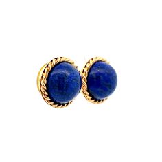 Add a touch of vintage elegance to your jewelry collection with these stunning Mid-Century Lapis Lazuli stud earrings. Crafted in 14k yellow gold, these earrings feature round cabochon cut Lapis Lazuli in a deep and rich blue hue. The stones have a total weight of 19.50 carats and are set in a twisted rope gold bezel, adding an intricate detail to these classic stud earrings. With their Mid-Century design, these earrings are a perfect addition to any vintage lover's wardrobe. Whether you're dressing up for a special occasion or adding a pop of color to your everyday look, these stud earrings are sure to make a statement. Luxury Blue Cabochon Earrings, Luxury Oval Cabochon Gemstone Earrings, Fine Jewelry Yellow Gold Cabochons For Formal Occasions, Luxury Round Cabochon Clip-on Earrings, Blue Classic Cabochons For Formal Occasion, Classic Blue Cabochons For Formal Occasion, Blue Classic Formal Cabochons, Blue Formal Classic Cabochons, Luxury Cabochon Earrings For Evening