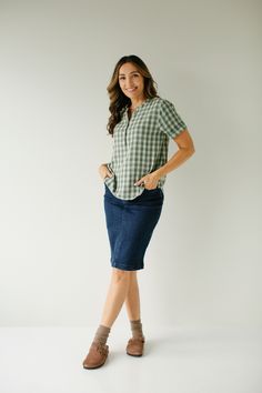 The 'Fern' top makes us reminisce about apple orchards, campfires, and fall leaves! The top features a modest neckline with functioning buttons, cuffed sleeves, and comes is a sweet soft green plaid. Dress it up with denim and wedge sandals for a night out, or a cardigan and boots for everyday wear! 100% Cotton Machine Wash Cold with Like Colors Hang or Lay Flat to Dry Do Not Bleach Warm Iron If Needed Model Height 5'9" | Wearing Size XS Wearing the 'Fern' Cotton Plaid Top with the 'Krista' Deni Modest Neckline, Layered Tops, Green Plaid, Plaid Tops, Skirt Leggings, Cuff Sleeves, Tops For Leggings, Blouse Dress, Sales Gifts