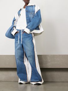 Jean Paul Gaultier's jeans bring together white cotton-twill panels with a vintage-inspired denim wash. They have a leather patch at the back as a tribute to the unconventional brand. Team yours with the matching jacket.