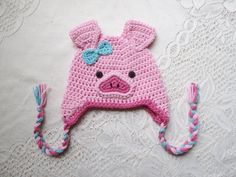 a crocheted hat with a pig on it