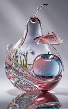 an apple shaped glass vase with flowers in it and water pouring out of the top