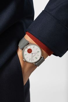 The NOMOS icon in color. Full of energy and complexity. For this special edition of the hand-wound Tangente 38 date model, numerous elements of the dial have been individually matched to the character of the watch. 31 special models for every day of the month, 31 different personalities—each limited to 175 pieces. The rich bright red of Tangente date Stop brings fire to the wrist and attracts attention, no matter what you wear with it. Limited Edition Tangente – 175 pieces CASE: stainless steel GLASS: sapphire crystal glass WINDING: manual DIMENSIONS: diameter 37.5 mm WATER RESISTANCE: 3 atm DIAL: cream white, sub-seconds brick red, date display at 6 o'clock, date background silver-white HANDS: rhodium-plated STRAP: textile Modern Watches With Date Indicator As Gift, Modern Watches With Subdials As Gifts, Modern Watches With Subdials For Gifts, Modern Analog Display Watch For Gift, Date Background, Louis Moinet, Different Personalities, Full Of Energy, Color Full