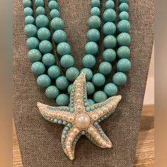 Turquoise Aqua Blue And Pearl Starfish Necklace Brand New, Never Worn. Turquoise/Aqua Blue Plastic Beads Culminate In Starfish Pearl Beaded Focal Piece. Ocean-inspired Starfish Charm Beaded Necklace, Turquoise Ocean-inspired Jewelry With Starfish Charm, Ocean-inspired Starfish Beaded Necklaces, Turquoise Starfish Ocean-inspired Jewelry, Blue Starfish Charm Necklace, Blue Star-shaped Beaded Necklace, Blue Beaded Necklaces With Starfish Charm, Blue Necklaces With Starfish Charm And Round Beads, Turquoise Ocean-inspired Necklace With Starfish Charm