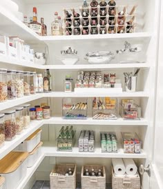 an organized pantry with lots of food in baskets on the shelves and other items inside