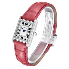 Cartier Tank Louis White Gold Diamond Pink Strap Ladies Watch WJTA0011 Card. Manual winding movement. 18k white gold case 29.5 x 22.0 mm. Circular grained crown set with diamond. Original Cartier factory diamond bezel. Scratch resistant sapphire crystal. Silver guilloche dial with black roman numerals. Sword shaped blue hands. Secret Cartier signature at X. Pink leather strap with 18K white gold deployant buckle. Cartier White Gold Diamond Watch With Chronometer, Elegant Red Watch With Diamond Hour Markers, Classic White Gold Watch Bands With Diamond Hour Markers, Elegant Red Watches With Diamond Hour Markers, Formal Red Jewelry With Diamond Hour Markers, Cartier Rectangular Watch For Anniversary, Rectangular Cartier Watch For Anniversary, Luxury Diamond Watch With Engraving, Luxury Diamond Watch Engraved