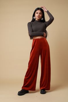 "PLEASE NOTE - Due to these trousers being handmade please allow 14-21 working days to be made and sent. The rust velvet trousers feature a soft 4 way stretch fabric complete an elasticated waistband and wide leg. Lightweight and versatile, perfect to pair with a cosy jumper for those spring walks or the black velvet halter for those festival adventures.. Trousers available in sizes 4,6,8,10,12,14,16,18,20: UK 4 - Waist 21\"- 22\", Hip 34\",  UK 6 - Waist 23\" - 24\", Hip 34\" UK 8 - Waist 25 \" Velvet Bottoms For Fall Loungewear, Fall Velvet Trousers, Fall Velvet Bottoms For Loungewear, Fall Velvet Loungewear Bottoms, Fall Velvet Wide Leg Straight Pants, Fall Velvet Wide Leg Pants, Cosy Jumper, Womens Trousers, Velvet Trousers