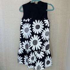 Victoria Beckham For Target Size: Xs Black & White Daisy Floral Printed Sleeveless Dress Scalloped Crew Neck W/ Tie And Buttons In Back Of Neck Lined Ruffle Hem Measurements Are Shown In The Photos Machine Wash New Condition. Never Worn. New With Tags Sleeveless Mini Dress With Daisy Print, Sleeveless Daisy Print Mini Dress, Casual Fitted Sunflower Print Dress, Casual Fitted Dress With Sunflower Print, Fitted Black Dress With Daisy Print, Fitted Summer Dress With Sunflower Print, Sleeveless Summer Dress With Daisy Print, Casual Sleeveless Daisy Print Dress, Sleeveless Daisy Print Sundress