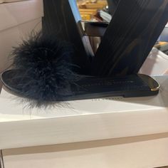 Flat Slipper With Feathers Trendy Black Slippers For Spring, Trendy Black Slippers, Elegant Black Slide Sandals, Trendy Black Spring Slippers, Black Open Toe Slippers For Party, Chic Black Slippers For Spring, Chic Black Spring Slippers, Black Flat Heel Slippers For Party, Chic Black Slide Sandals