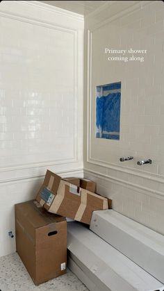 boxes are stacked on top of each other in the bathroom