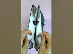 someone is holding an origami piece in their hands