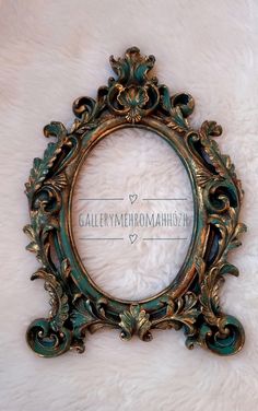 an ornate gold and green frame on a white furnishing background with the word gallery mehromanahhy written below it