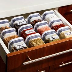 the drawers are filled with spices and seasonings