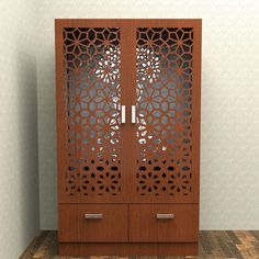 a wooden cabinet with laser cut designs on the front and sides, in a room