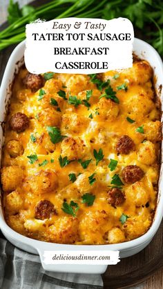 tater tot sausage breakfast casserole in a white dish on a wooden table