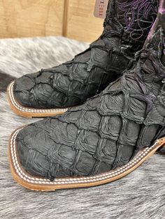 Check out this gorgeous new ladies’ Anderson Bean, exclusive to Painted Cowgirl Western Store. This show stopping boot is made with a unique black and iridescent purple Arapaima (Big Bass) vamp and a beautifully embroidered black explosion shaft. Designed with a hybrid sole for ultimate comfort and resistance to wear. The hybrid is AB's most popular sole. It features a long-wearing, flexible PVC insert in the ball area of our prime leather sole, and it has a ribbed surface that improves grip and Square Toe Cowgirl Boots, Anderson Bean Boots, Iridescent Purple, Western Store, Boot Companies, Square Toe Boots, Cowgirl Western, Bean Boots, Cowgirl Boots