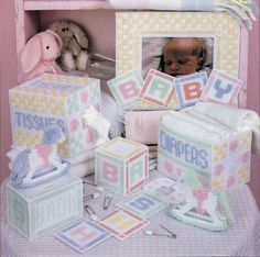 a baby's first birthday gift set in a pink box with an elephant and other items