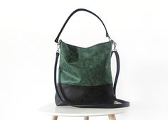 Vegan leather hobo bag in medium size The bag is made of premium quality vegan leather in beautiful forest green color for the top part and black for the bottom.  The material is soft, light-weight but well structured and has nubuck leather feel.  It has a slouchy silhouette and plenty of room for your daily needs. The bag features: - lining made of cotton fabric in solid light brown color - two slip inner pockets - magnetic snap closure - detachable short strap (and long strap if added) made of Green Hobo Bag With Adjustable Strap For On-the-go, Green Rectangular Hobo Bag With Detachable Handle, Green Hobo Bag With Leather Handles For On-the-go, Chic Green Hobo Bag With Adjustable Strap, Green Shoulder Bag With Detachable Handle, Chic Green Hobo Bag With Leather Handles, Everyday Green Shoulder Bag With Detachable Handle, Green Crossbody Hobo Bag With Detachable Handle, Green Hobo Bag With Adjustable Strap