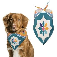 a brown dog wearing a bandana next to a white and blue flowered bib