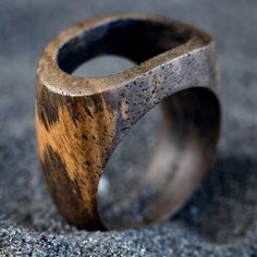 a wooden ring sitting on top of gravel