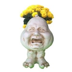 a white statue with yellow flowers in it's head and eyes, on a white background