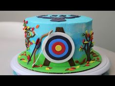 a birthday cake decorated with an archery theme