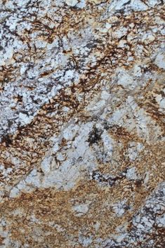 an image of a marble surface that looks like it has brown and white streaks on it