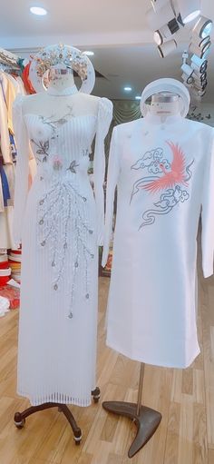 Beautiful traditional Vietnamese Ao Dai made to fit your measurements! - Choose between 3 variations - White color with phoenix lace & embroidered patterns - Can be ordered as a single Ao dai for the lady or with the matching male Ao dai - Style 3 has added train for the lady's ao dai Optional head piece at extra cost: please message us with a style you want Price include pants for the lady's Ao dai The dress will need 2-3 weeks to be made. Please send us your body measurements (see last ima Traditional Fitted White Wedding Dress, Fitted White Ao Dai For Ceremonies, Traditional White Ao Dai For Party, Traditional White Ao Dai For Wedding, White Fitted Ao Dai For Wedding, White Long Sleeve Sets For Wedding Night, White Ceremony Sets For Spring, White Long Sleeve Sets For Wedding, White Wedding Sets For Spring