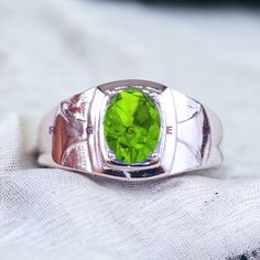 NATURAL PERIDOT GEM RING WEDDING BAND GIFT AND MEMENTOS Item Description:- MATERIAL-Silver METAL PURITY- 925 Sterling Silver GEMSTONE- Peridot Gemstone GEMSTONE COLOR- Green GEMSTONE SHAPE- Oval GENDER- Female, Male BIRTHSTONE- August JEWELRY TYPE- Ring HEALING PROPERTIES OF GEMSTONE- Healing with Peridot It Alleviates jealousy, resentment, spite, bitterness, irritation, hatred, and greed. Reduces stress, anger, and guilt. Peridot opens our hearts to joy and new relationships. It enhances confid Lime Green Gemstone Birthstone Ring For Gift, Lime Green Gemstone Birthstone Ring As Gift, Oval Green Signet Ring For Wedding, Green Oval Signet Ring For Wedding, Lime Green Birthstone Ring As A Gift, Lime Green Peridot Rings For Promise, Green Signet Ring For Wedding, May Birthstone, Lime Green Round Ring As A Gift, Lime Green Birthstone Ring As Gift