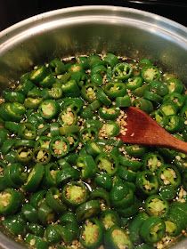 a pan filled with green peppers and seasoning