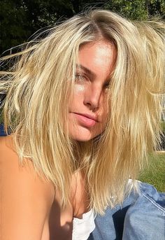 A close-up of a woman with layered, blonde hair that looks windswept and textured, ideal for summer. The hair frames her face softly while she enjoys a summer picnic outdoors, with the sunlight gently illuminating her locks." Layered Blonde, Hair Mistakes, Blonde Layers, Summer Haircuts, Summer Hair, Summer Picnic, Summer Hairstyles, Blonde Hair, Close Up