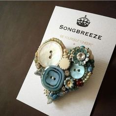 there is a brooch with buttons attached to it