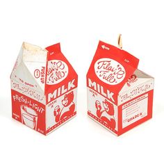 two boxes of milk sitting next to each other