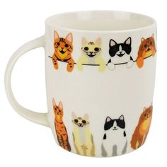 a white coffee cup with cats on it