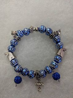 8" Blue and silver beaded bracelet with multi charms (With magnetic clasp) Blue Crystal Bracelet With Silver Beads, Blue Jewelry With Dangling Charms For Jewelry Making, Blue Jewelry With Silver Metal Beads, Blue Metal Beads Jewelry As Gift, Blue Metal Beads Jewelry For Gifts, Adjustable Blue Beaded Charm Bracelet, Blue Nickel-free Charm Bracelet With Round Beads, Blue Jewelry With Dangling Charms, Blue Charm Bracelet Jewelry