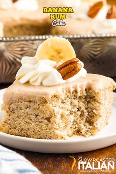 a piece of banana bum cake on a white plate with whipped cream and pecans