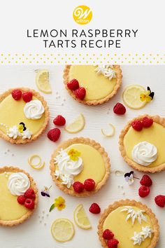 lemon raspberry tarts with whipped cream and fresh berries on the top are arranged in small pies