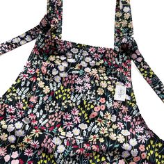 🌸❤️🧵 HANDMADE FLORAL DUNGAS! 🧵❤️🌸  These relaxed fit dungarees are made from poly cotton fabric, are fully lined and have adjustable tie fastenings at the top.  Long dungarees come with 5 pockets - 1 bib and 2 side pockets on the front and 2 side pockets on the back.  Short dungarees come with 3 pockets - 1 bib pocket on the front and 2 side pockets on the back.  Dungaree dress come with 3 pockets - 1 bib pocket and 2 side pockets on the front. If you would prefer different pocket placement Cotton Shortalls With Adjustable Straps And Relaxed Fit, Cotton Overalls With Adjustable Straps, Cotton Relaxed Fit Shortalls With Adjustable Straps, Summer Floral Print Cotton Overalls, Casual Overalls With Tie Straps And Bib Front, Cotton Jumpsuit With Adjustable Straps And Bib Front, Cotton Jumpsuits And Rompers With Adjustable Straps, Spring Cotton Overalls With Adjustable Straps, Cotton Overalls With Tie Straps