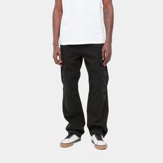 The Regular Cargo Pant is constructed from a midweight organic cotton twill, which has been garment dyed to give it a unique color. It features multiple pockets and a woven Carhartt WIP label on the right leg pocket. A double layer at the knee adds to its robust qualities, and tie detailing at leg opening allows for the fit to be adjusted.
 100% Organic Cotton 'Moraga' Twill, 8.25 oz regular fit, low waist double layer at knee bartack stitching at vital stress points square label zip fly Urban Straight Leg Cotton Cargo Pants, Chino Cotton Twill Cargo Pants With Pockets, Urban Style Cotton Cargo Work Pants, Washed Black Straight Leg Cotton Cargo Pants, Washed Black Cotton Cargo Bottoms, Washed Black Relaxed Fit Cotton Cargo Pants, Washed Black Wide Leg Cotton Cargo Pants, Wide-leg Washed Black Cotton Cargo Pants, Washed Black Cotton Pants With Hip Pockets