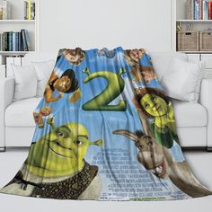 a blanket with the number two on it in front of a white couch